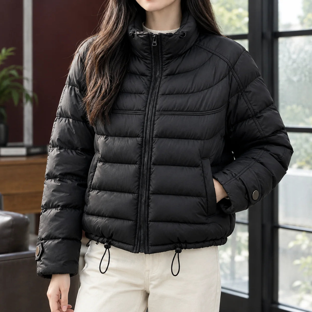 Women's cropped quilted jacket in black with drawcord hem