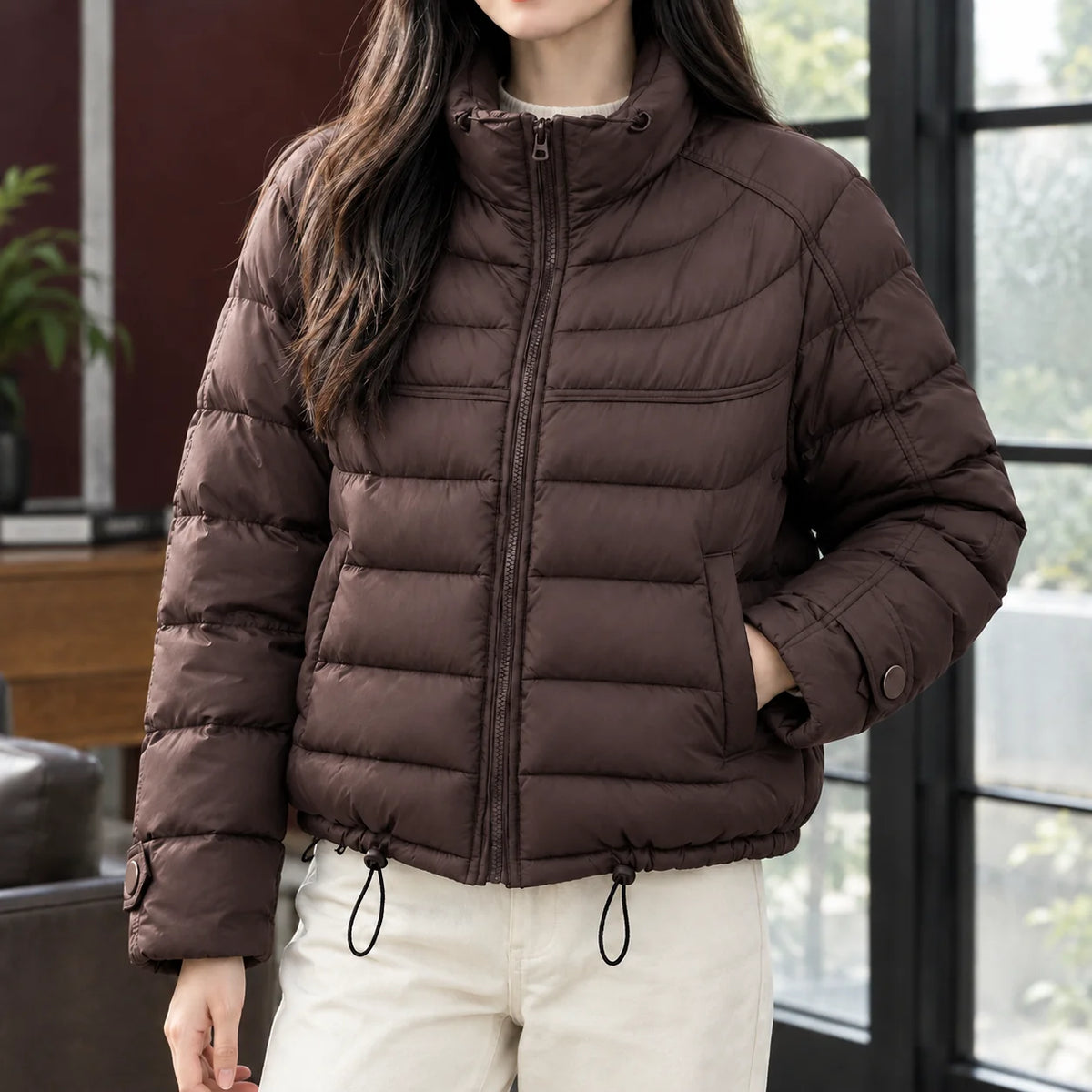 Women's cropped quilted jacket in pink with drawcord hem