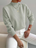 Women's green oversized mock neck sweater