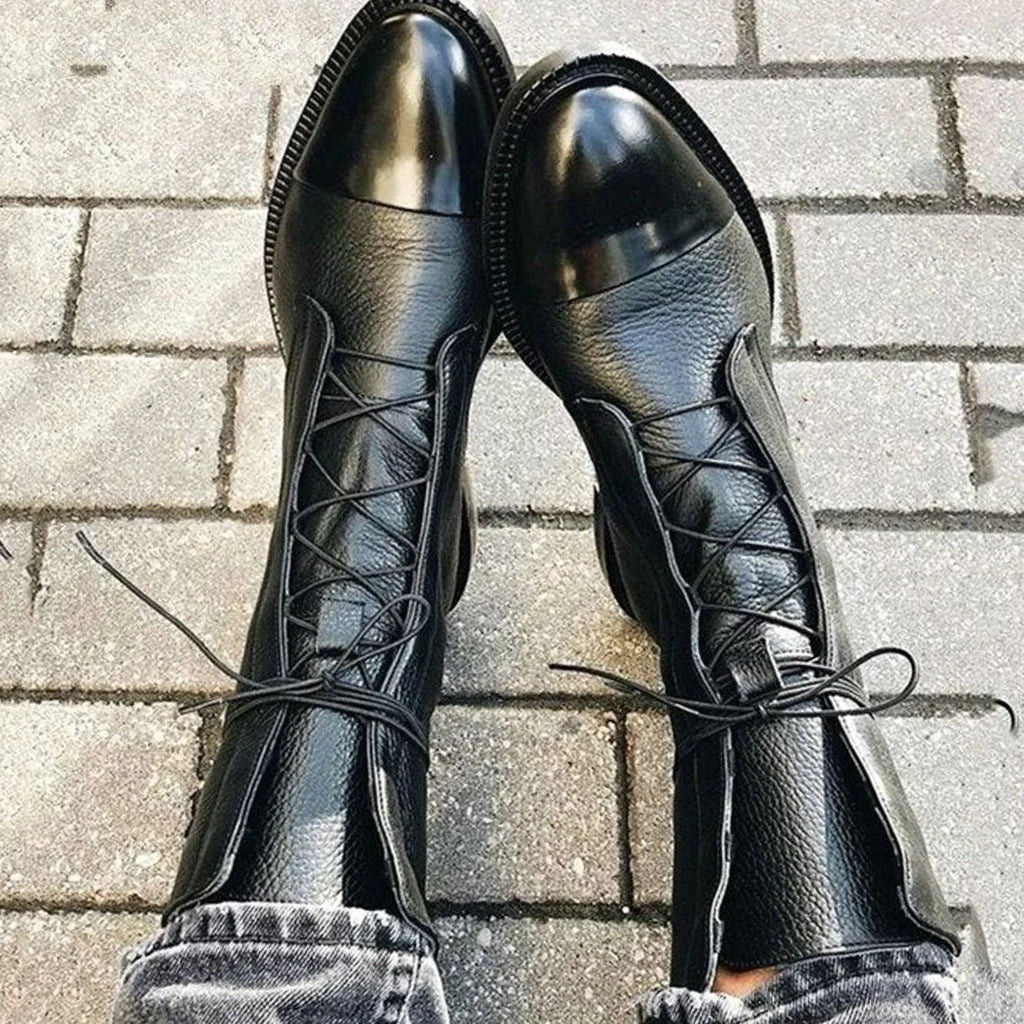 Women's leather lace-up boots in black with patent cap toe