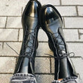 Women's leather lace-up boots in black with patent cap toe