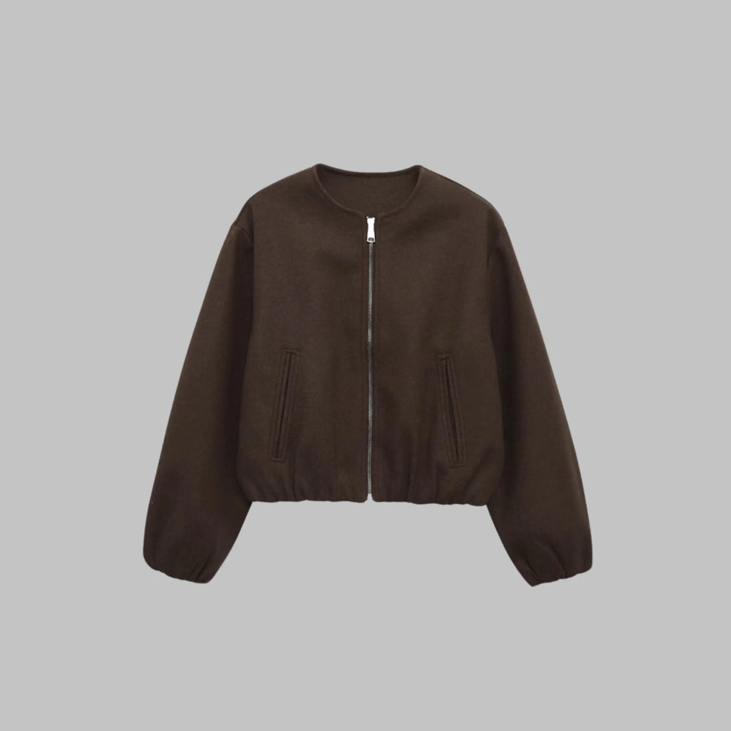 Women's collarless cropped jacket in brown, close-up of elastic hem