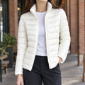 Women's lightweight puffer jacket in white with stand collar