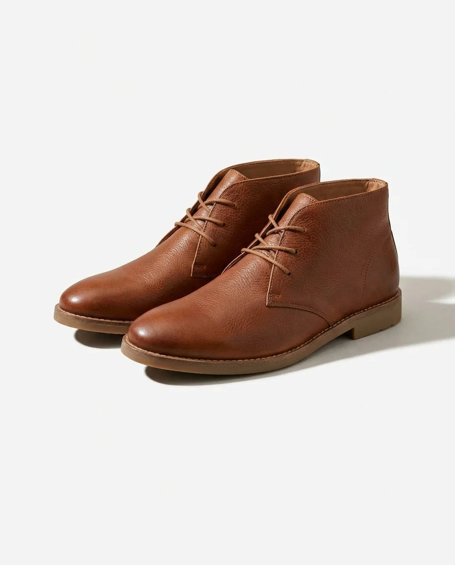 Men's pull-up leather Chukka boots styled on foot