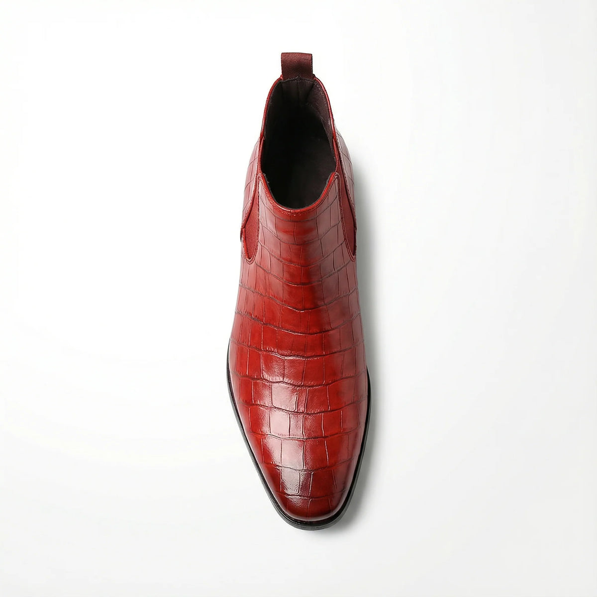 Men's alligator-embossed leather Chelsea boots styled on foot