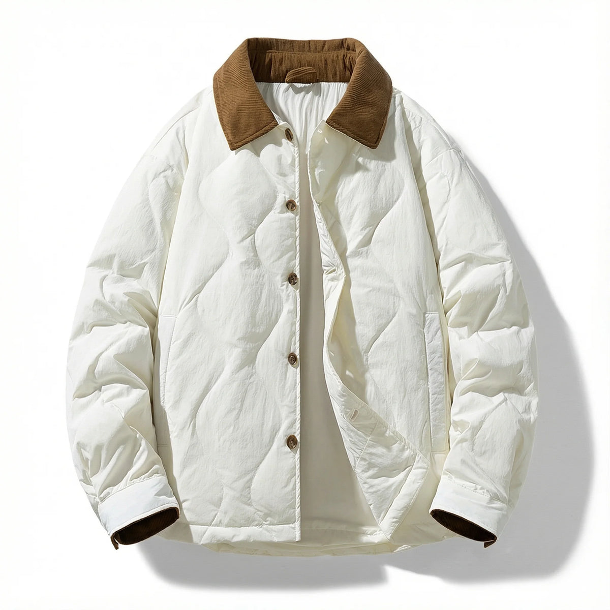 Close-up of the side pocket on the gray quilted jacket