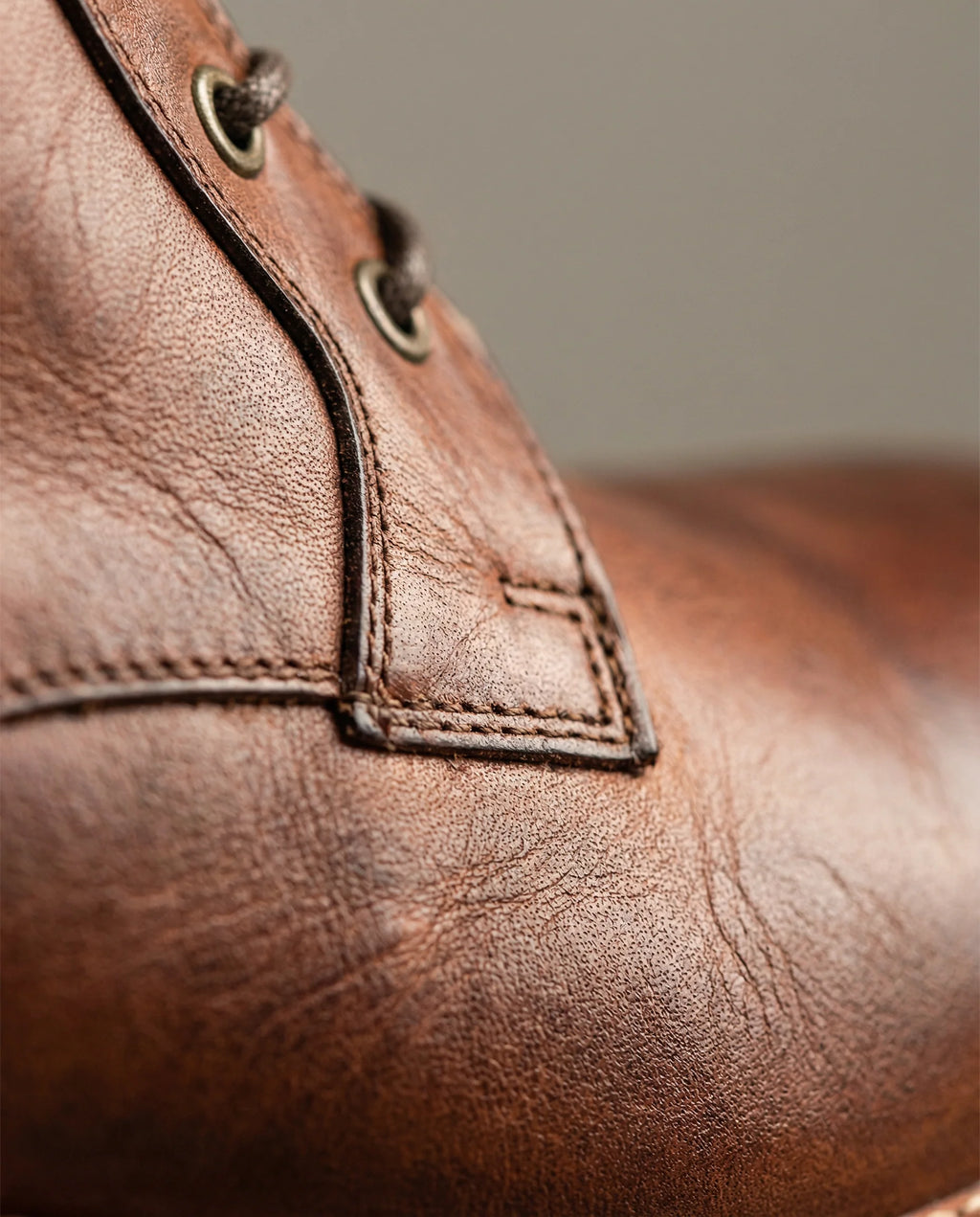 Men's leather work boots in black with brass-eyelet lacing