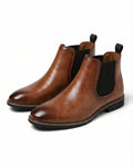 Close-up of the contrast-stitched sole on the brown Chelsea boots