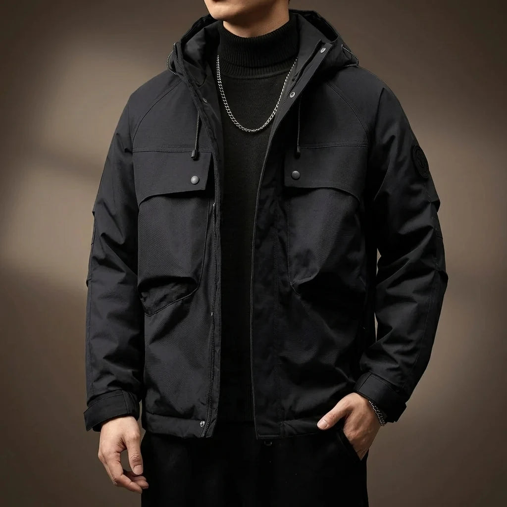 Close-up of the cargo flap pocket on the men's green field jacket