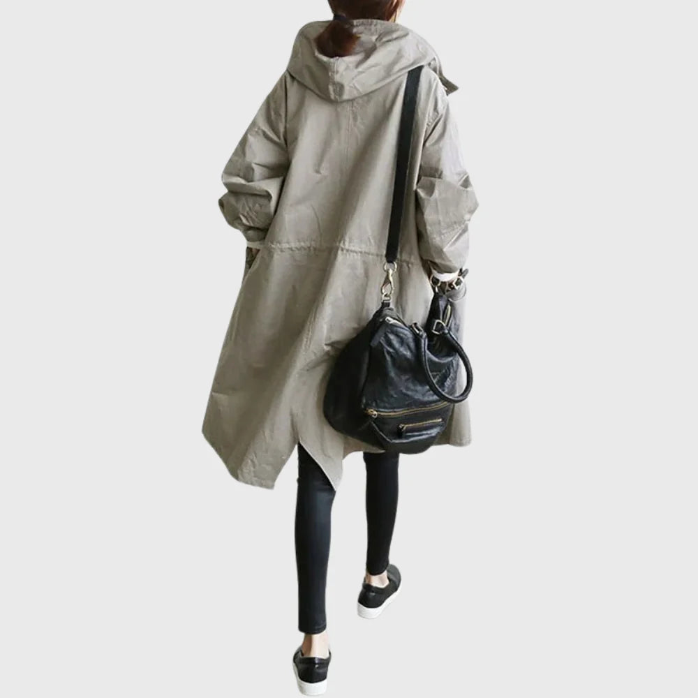 Close-up of the button-front placket on the women's trench coat
